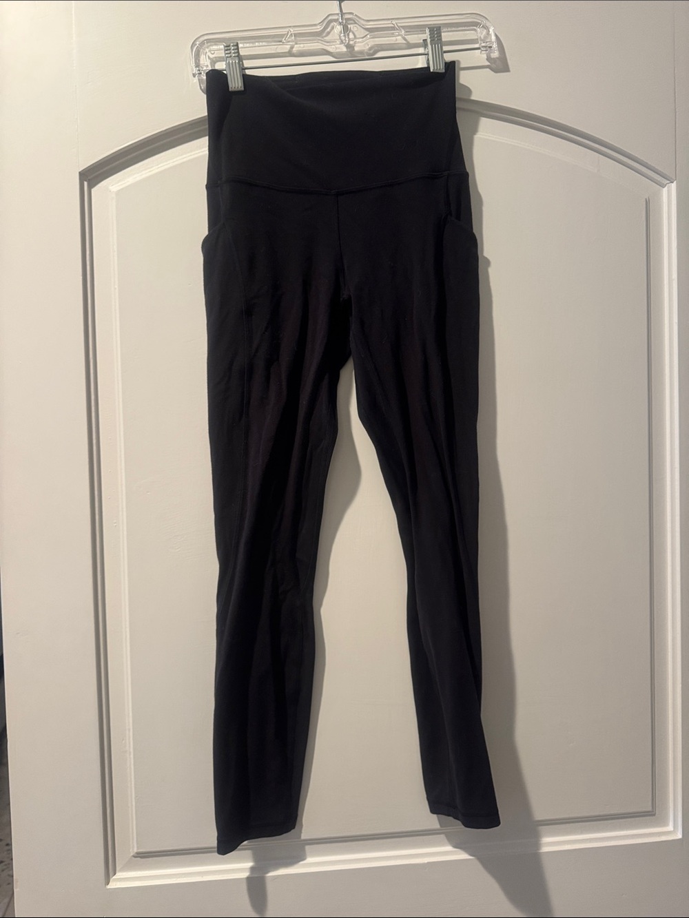 Black High-Waist Yoga Leggings align with pockets